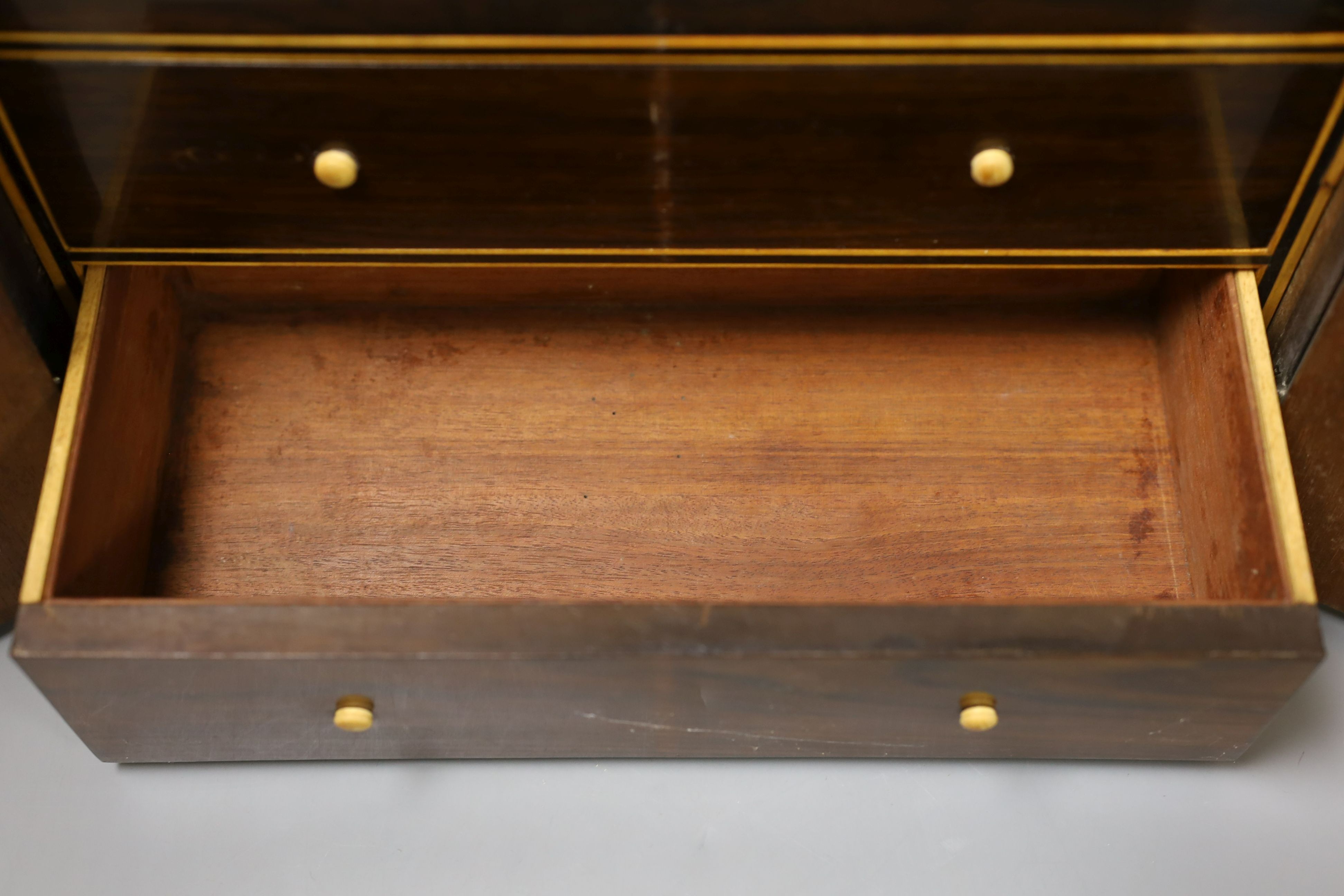 A Regency brass inlaid rosewood table cabinet, fitted with five drawers - 30cm tall